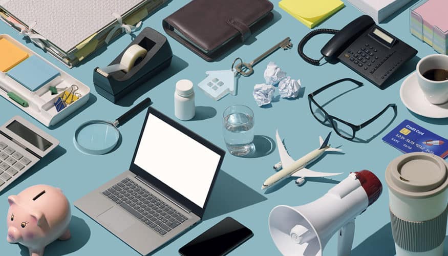 Messy cluttered business desktop with assorted isometric objects: disorganized workstation concept