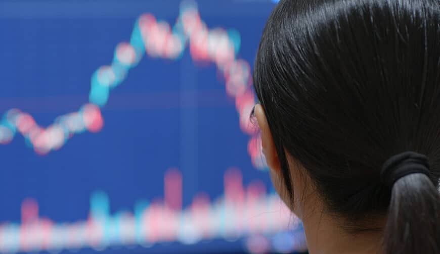 Woman watching the stock market graph